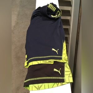 PUMA : 2 pairs of boys size M Puma shorts with pockets. 1 navy 1 black